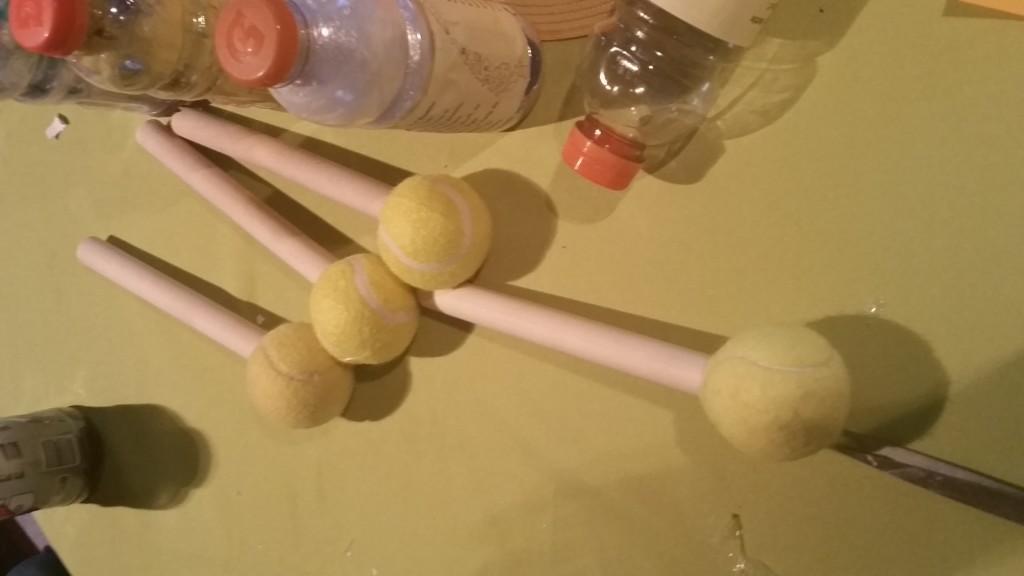 Wooden dowels come in pretty handy when trying to press and compact the plastic within the Gatorade bottles! The tennis balls help you maintain a strong grip. You'll be amazed at how much you can fit into each bottle!